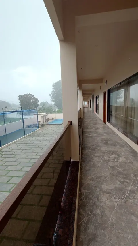 Open corridor overlooking the pool and courtyard