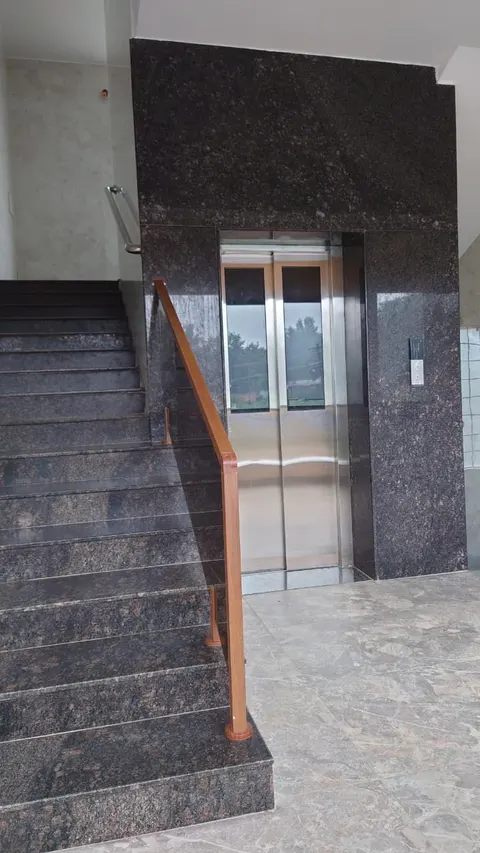 Granite staircase and lift in the resort lobby