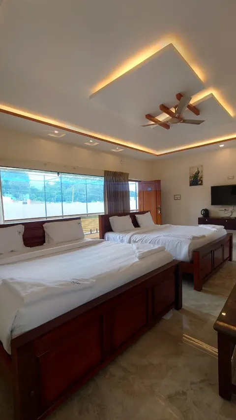 Suite with two beds and a large picture window